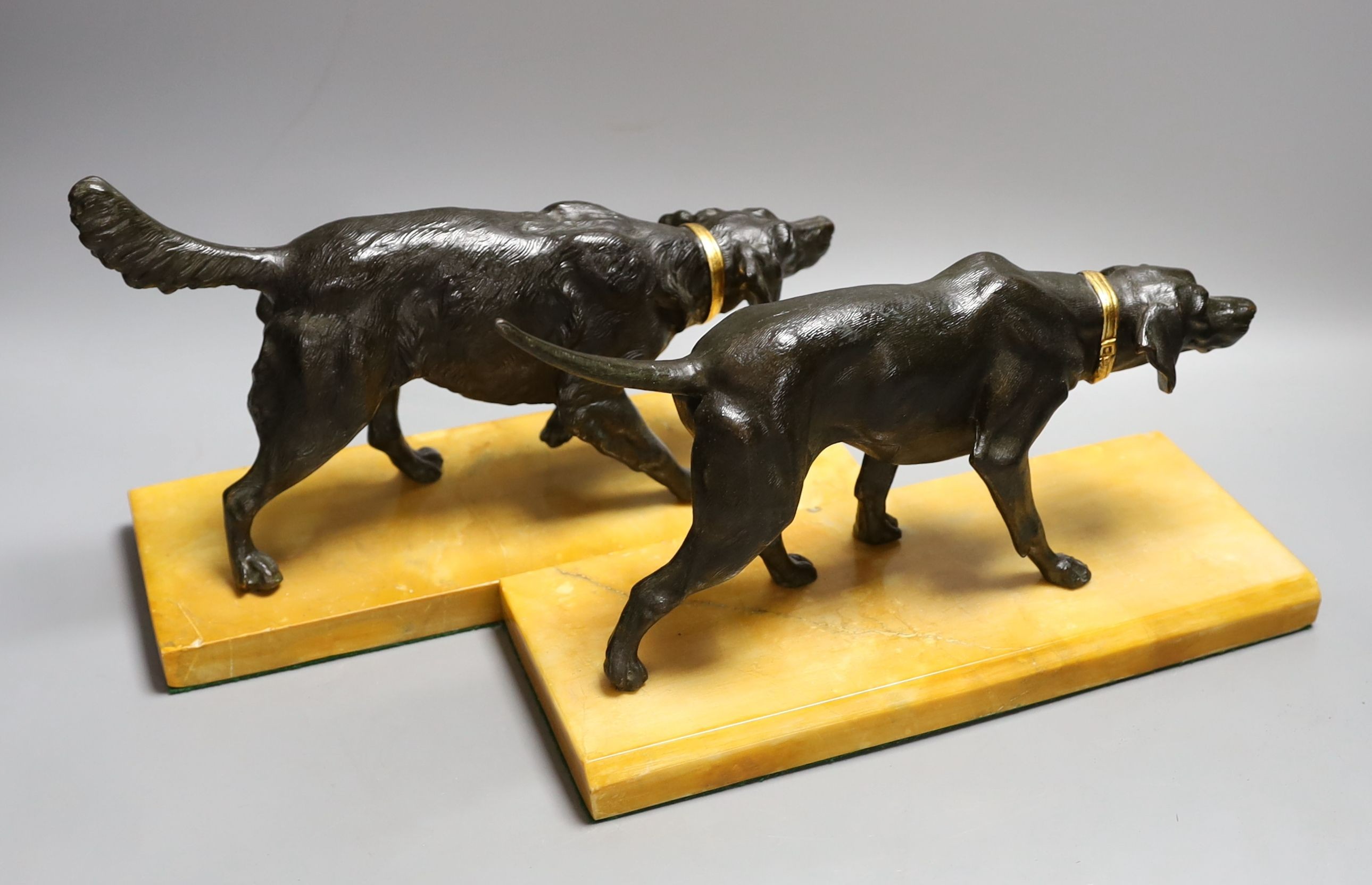 A pair of bronzed spelter dogs on base - 29cm long